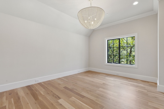 unfurnished room featuring light wood-style flooring, baseboards, recessed lighting, and a notable chandelier