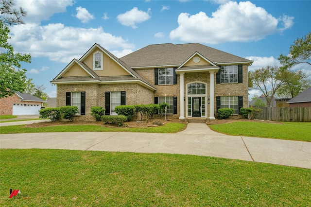 339 Hunters Holw, Bossier City, LA 71111 - greek revival house with a front yard, fence, and brick siding