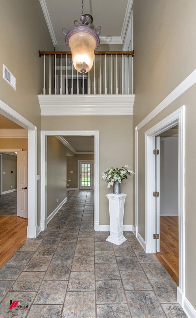 339 Hunters Holw, Bossier City, LA 71111 - corridor with a towering ceiling, ornamental molding, baseboards, and visible vents