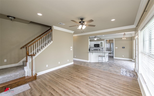 339 Hunters Holw, Bossier City, LA 71111 - unfurnished living room featuring visible vents, crown molding, baseboards, stairway, and a ceiling fan