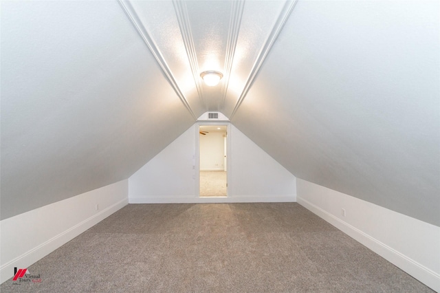 339 Hunters Holw, Bossier City, LA 71111 - additional living space featuring baseboards, visible vents, vaulted ceiling, and light colored carpet