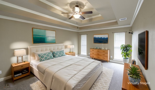 339 Hunters Holw, Bossier City, LA 71111 - carpeted bedroom featuring ornamental molding, baseboards, a raised ceiling, ceiling fan, and visible vents