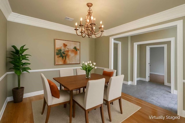 339 Hunters Holw, Bossier City, LA 71111 - dining room featuring baseboards, a chandelier, wood finished floors, and crown molding