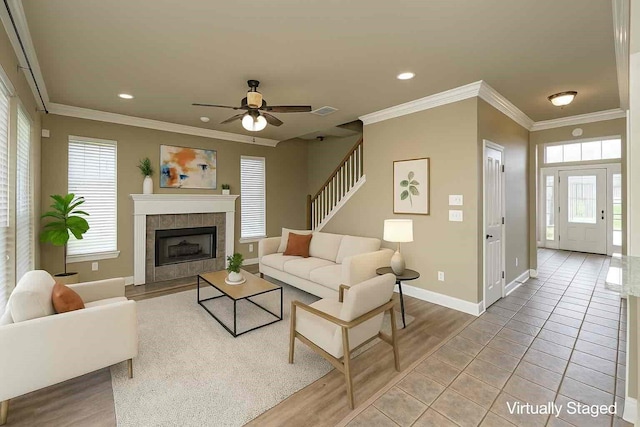 339 Hunters Holw, Bossier City, LA 71111 - living area featuring baseboards, ceiling fan, a tile fireplace, recessed lighting, and ornamental molding
