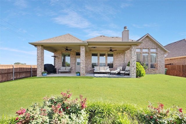 216 Equestrian Rd, Hickory Creek, TX 75065 - back of property with ceiling fan, an outdoor living space, brick siding, a chimney, and a patio