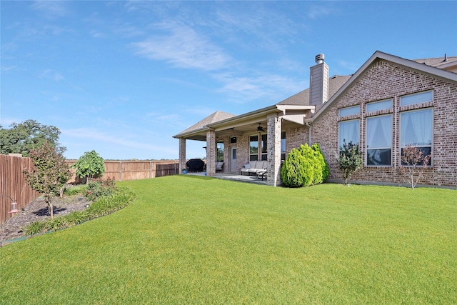 216 Equestrian Rd, Hickory Creek, TX 75065 - rear view of property with a ceiling fan, a patio area, a chimney, brick siding, and a shingled roof