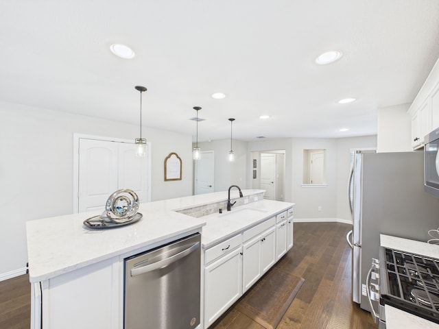 kitchen with a kitchen island with sink, recessed lighting, a sink, and stainless steel appliances