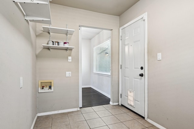 10319 Sylvia Dr, Dallas, TX 75228 - clothes washing area with hookup for a washing machine, baseboards, and light tile patterned floors