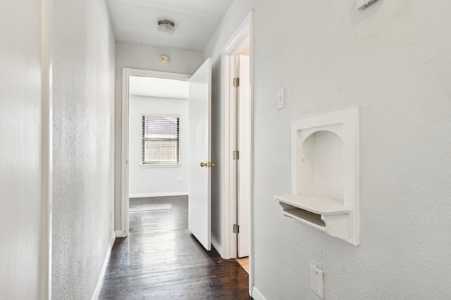 10319 Sylvia Dr, Dallas, TX 75228 - hallway with baseboards and dark wood-style floors
