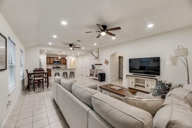 2282 Torch Lake Dr, Forney, TX 75126 - living area featuring light tile patterned floors, visible vents, arched walkways, ceiling fan, and recessed lighting