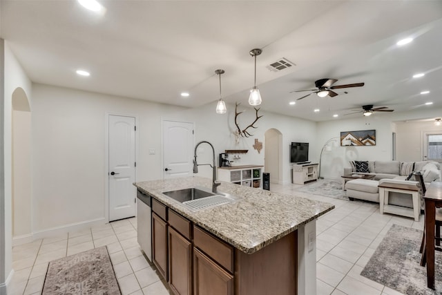 2282 Torch Lake Dr, Forney, TX 75126 - kitchen with a sink, arched walkways, visible vents, dishwasher, and a ceiling fan