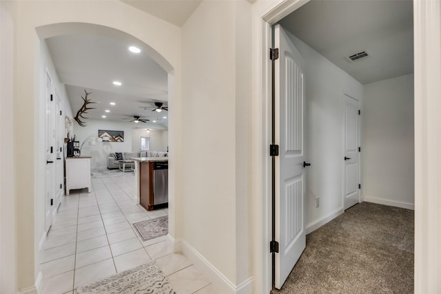 2282 Torch Lake Dr, Forney, TX 75126 - corridor featuring recessed lighting, light tile patterned floors, baseboards, arched walkways, and visible vents