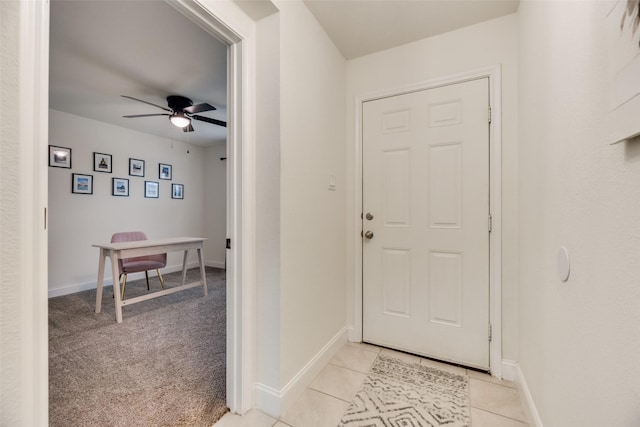 2282 Torch Lake Dr, Forney, TX 75126 - foyer entrance with light carpet, baseboards, light tile patterned floors, and a ceiling fan