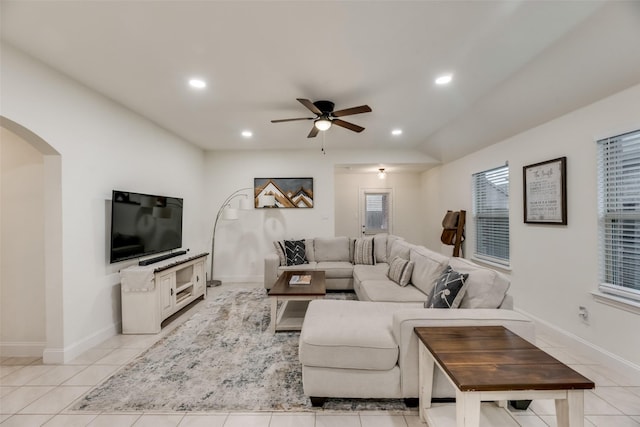 2282 Torch Lake Dr, Forney, TX 75126 - living room with recessed lighting, a ceiling fan, arched walkways, lofted ceiling, and light tile patterned floors