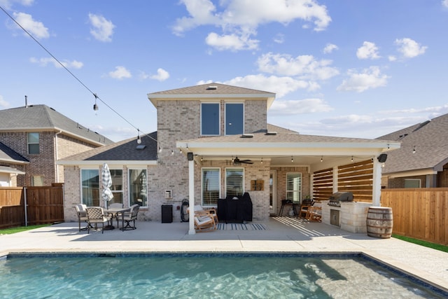 16509 Hidden Cove Dr, Celina, TX 75009 - rear view of property with exterior kitchen, a fenced backyard, brick siding, and a patio