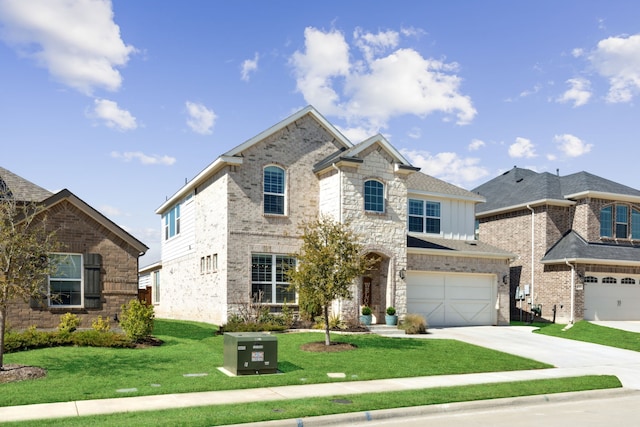 16509 Hidden Cove Dr, Celina, TX 75009 - french country inspired facade featuring driveway, an attached garage, a front lawn, board and batten siding, and stone siding