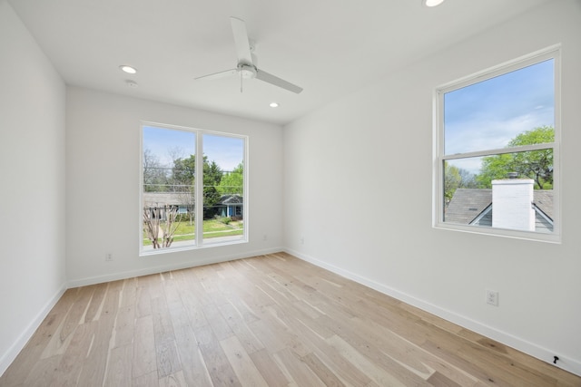 unfurnished room featuring light wood-type flooring, recessed lighting, a ceiling fan, and baseboards