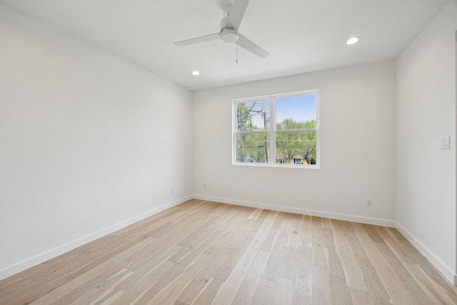 spare room with a ceiling fan, light wood-style flooring, recessed lighting, and baseboards