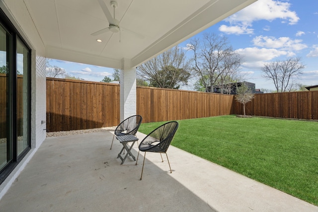 view of patio with ceiling fan and a fenced backyard