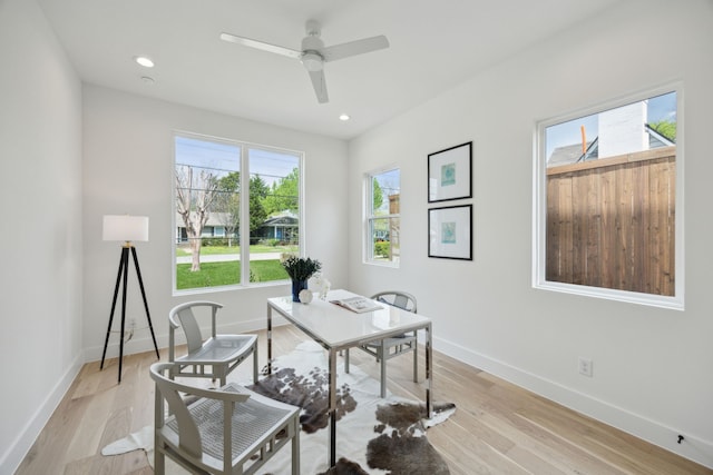 office featuring recessed lighting, ceiling fan, light wood-style floors, and baseboards
