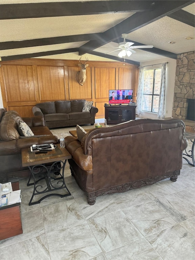 901 Freestone Ct, Arlington, TX 76017 - living area with a textured ceiling, wooden walls, vaulted ceiling with beams, and a ceiling fan