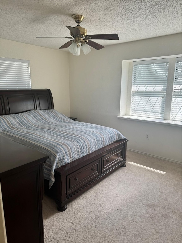 901 Freestone Ct, Arlington, TX 76017 - bedroom with baseboards, carpet floors, a textured ceiling, and a ceiling fan