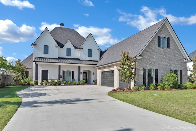 1113 Forest Trail Dr, Shreveport, LA 71106 - french country inspired facade featuring brick siding, concrete driveway, a front lawn, a garage, and a chimney