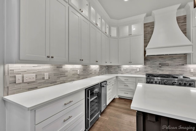 1113 Forest Trail Dr, Shreveport, LA 71106 - kitchen featuring custom exhaust hood, wine cooler, light countertops, and backsplash