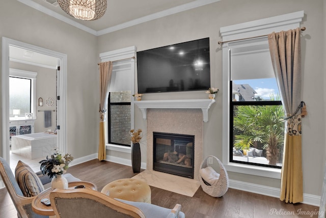 1113 Forest Trail Dr, Shreveport, LA 71106 - living area with a fireplace with flush hearth, wood finished floors, and crown molding