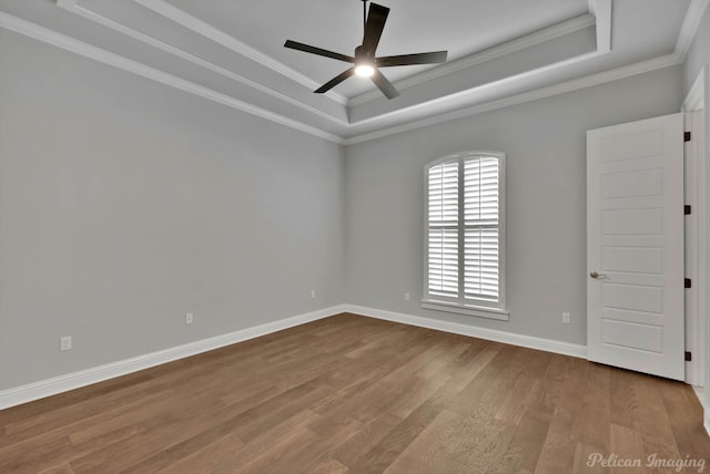 1113 Forest Trail Dr, Shreveport, LA 71106 - empty room with a tray ceiling, wood finished floors, ceiling fan, and ornamental molding