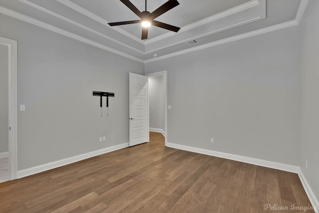1113 Forest Trail Dr, Shreveport, LA 71106 - spare room featuring a ceiling fan, a raised ceiling, wood finished floors, and crown molding
