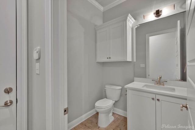 1113 Forest Trail Dr, Shreveport, LA 71106 - half bath featuring ornamental molding, vanity, and wood finished floors