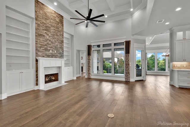 1113 Forest Trail Dr, Shreveport, LA 71106 - unfurnished living room with ceiling fan, a premium fireplace, recessed lighting, built in shelves, and beam ceiling