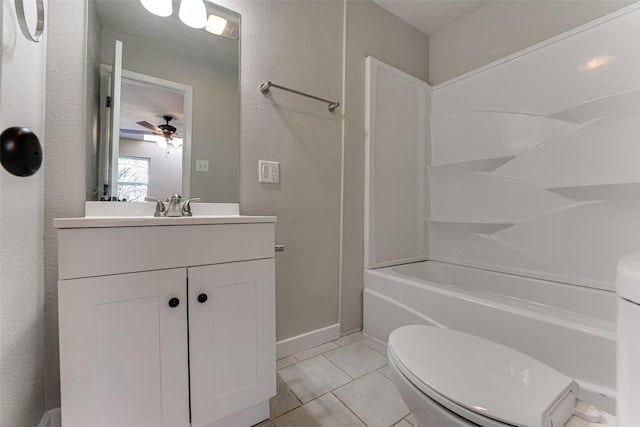 full bath with vanity, a ceiling fan, toilet, shower / bath combination, and tile patterned floors