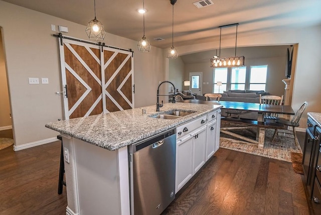 201 Virginia Ln, Hickory Creek, TX 75065 - kitchen with stainless steel dishwasher, dark wood-style flooring, white cabinetry, light stone countertops, and a barn door