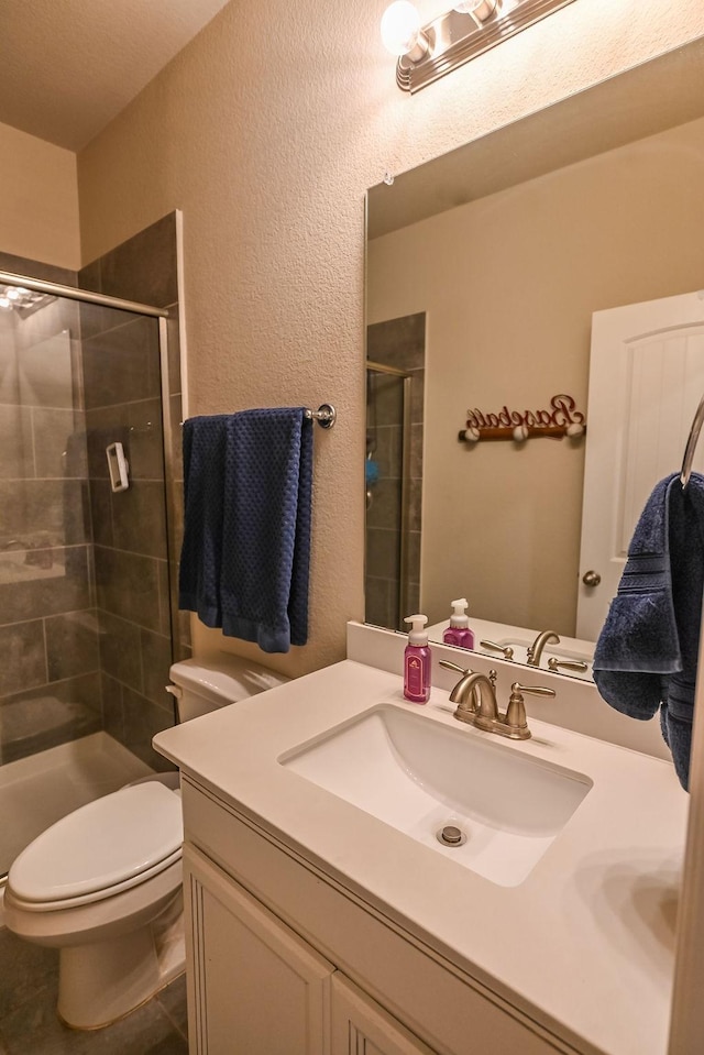 201 Virginia Ln, Hickory Creek, TX 75065 - bathroom featuring vanity, a shower stall, and a textured wall