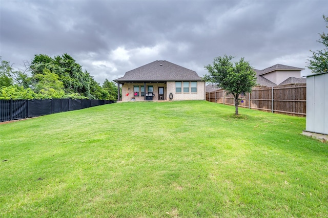 201 Virginia Ln, Hickory Creek, TX 75065 - rear view of property with a fenced backyard and brick siding