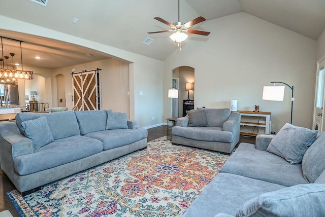 201 Virginia Ln, Hickory Creek, TX 75065 - living area featuring arched walkways, lofted ceiling, a ceiling fan, and wood finished floors