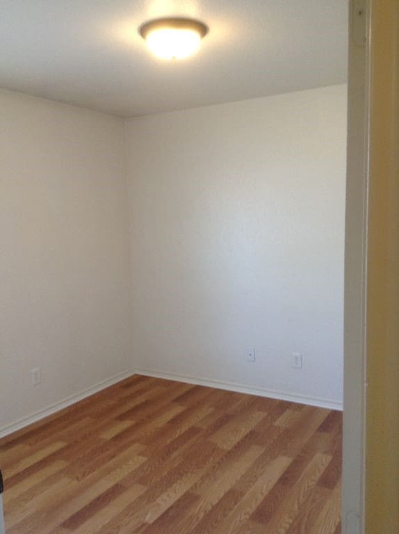 8124 Doreen Ave, Fort Worth, TX 76116 - unfurnished room featuring baseboards and wood finished floors