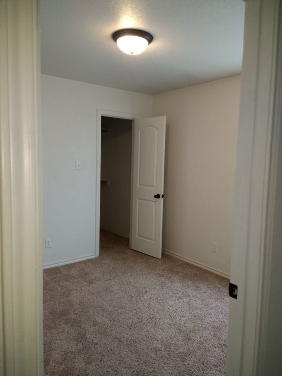 8124 Doreen Ave, Fort Worth, TX 76116 - unfurnished room featuring baseboards and carpet flooring