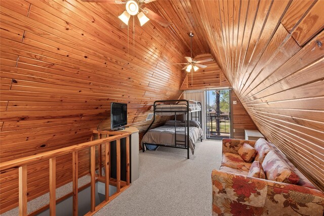 carpeted bedroom featuring wooden ceiling, wood walls, lofted ceiling, and access to exterior