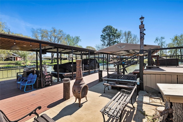 exterior space with boat lift and a water view