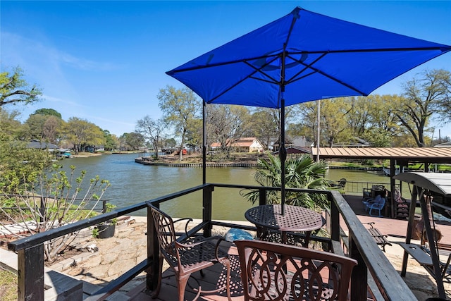 wooden deck with a water view