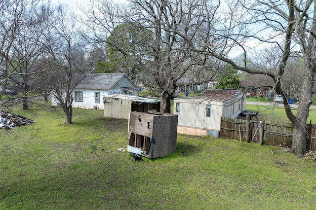 210AND218 N Collins, Colbert, OK 74733 - view of yard with an outbuilding, fence, and a storage shed