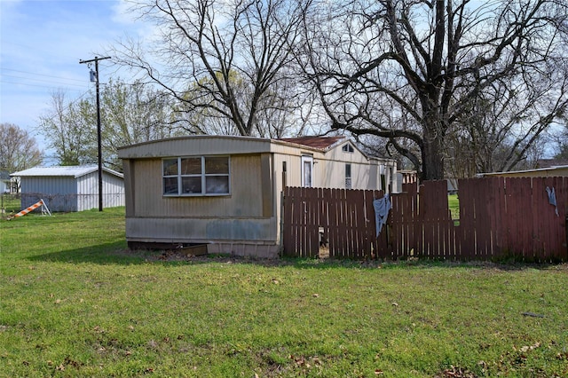210AND218 N Collins, Colbert, OK 74733 - view of side of property featuring fence and a yard
