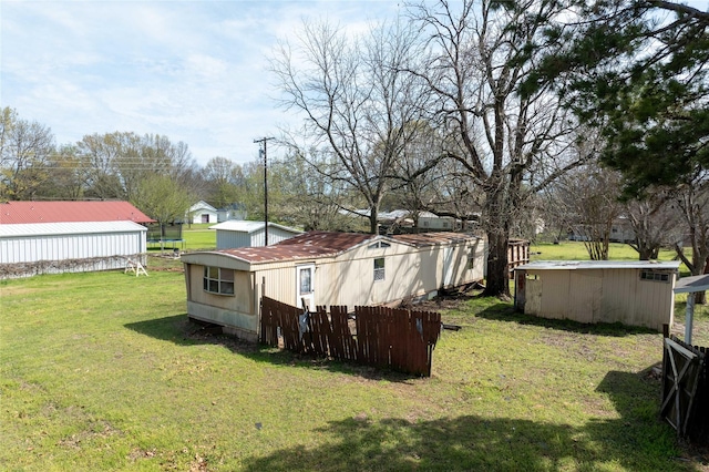 210AND218 N Collins, Colbert, OK 74733 - view of yard featuring an outbuilding and fence