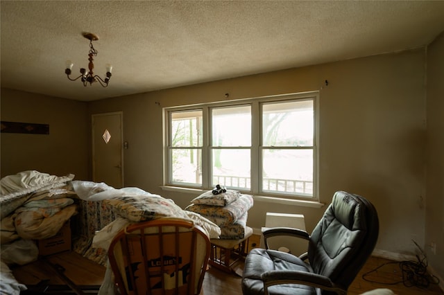 210AND218 N Collins, Colbert, OK 74733 - interior space with an inviting chandelier and a textured ceiling