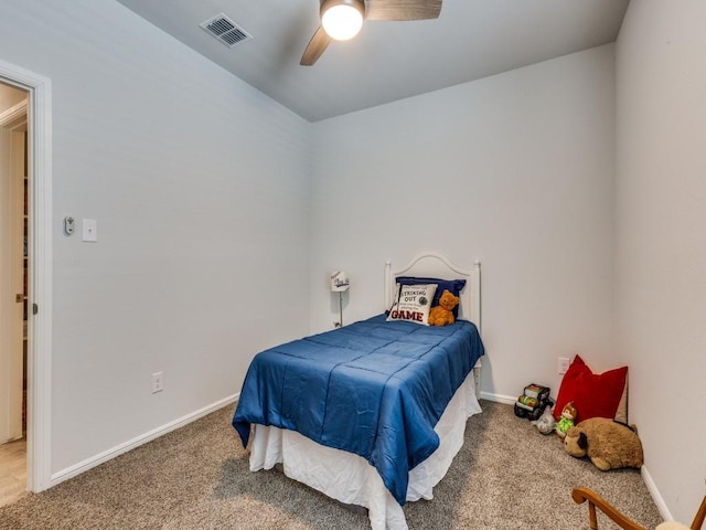 bedroom with carpet floors, baseboards, and visible vents