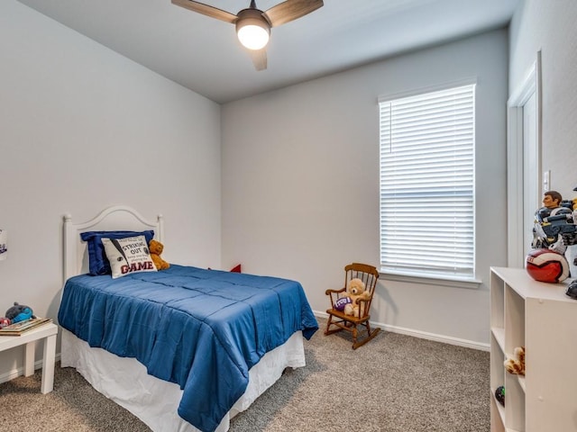 bedroom featuring carpet, multiple windows, ceiling fan, and baseboards
