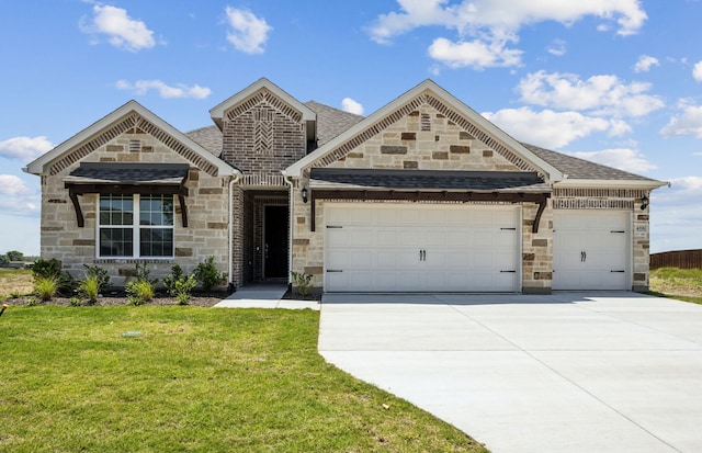 4376 Noble Ln, Midlothian, TX 76065 - view of front of property with stone siding, a garage, and concrete driveway